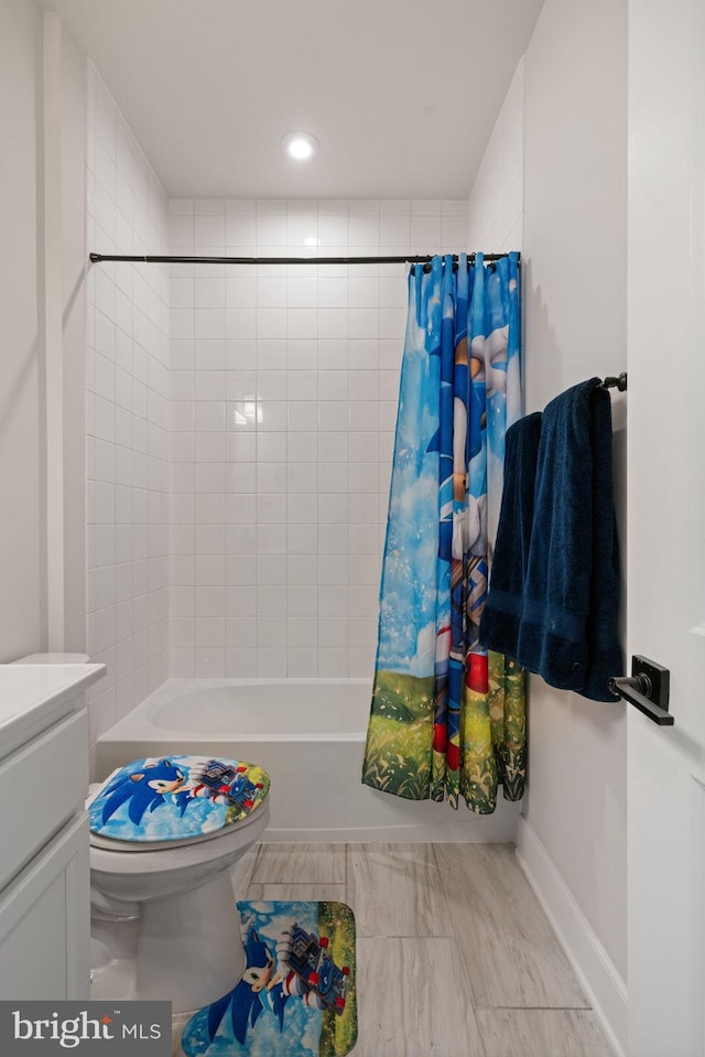 17303 Turnstone Dr, Dumfries, VA 22026 - full bath with shower / tub combo with curtain, toilet, baseboards, recessed lighting, and vanity