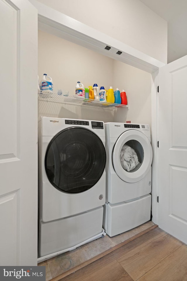 17303 Turnstone Dr, Dumfries, VA 22026 - laundry room with independent washer and dryer and light wood-style floors