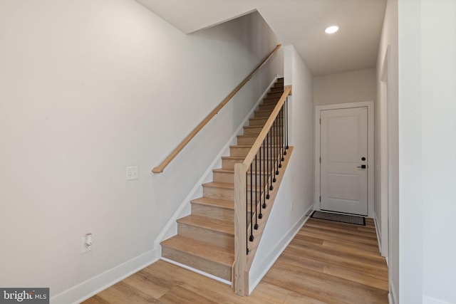 17303 Turnstone Dr, Dumfries, VA 22026 - stairs featuring wood finished floors, baseboards, and recessed lighting
