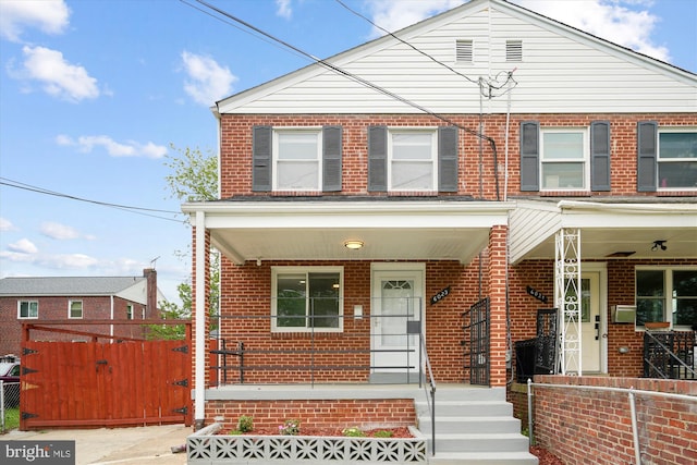 6023 20th Ave, Hyattsville, MD 20782 - view of property featuring brick siding, a porch, and fence