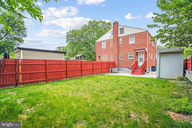 6023 20th Ave, Hyattsville, MD 20782 - back of house with entry steps, central AC unit, a chimney, and a patio area
