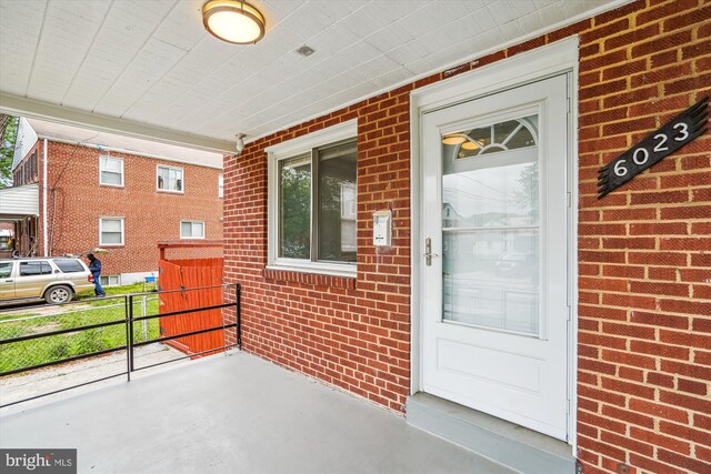 6023 20th Ave, Hyattsville, MD 20782 - view of exterior entry with brick siding and a porch