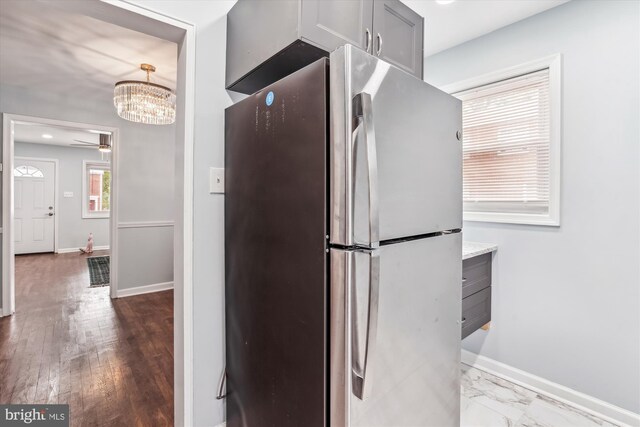 6023 20th Ave, Hyattsville, MD 20782 - kitchen featuring freestanding refrigerator, a chandelier, baseboards, and light countertops