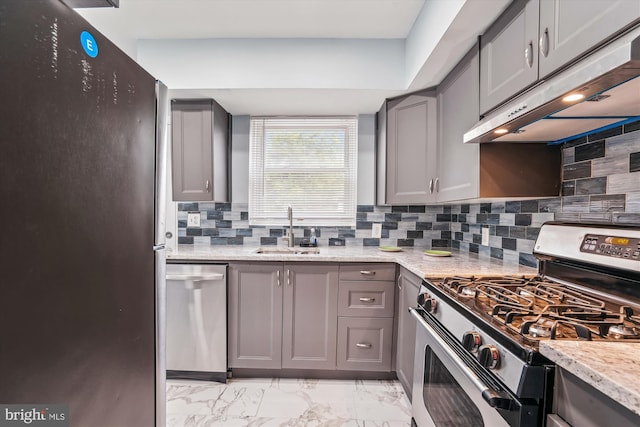 6023 20th Ave, Hyattsville, MD 20782 - kitchen featuring appliances with stainless steel finishes, under cabinet range hood, a sink, and gray cabinets