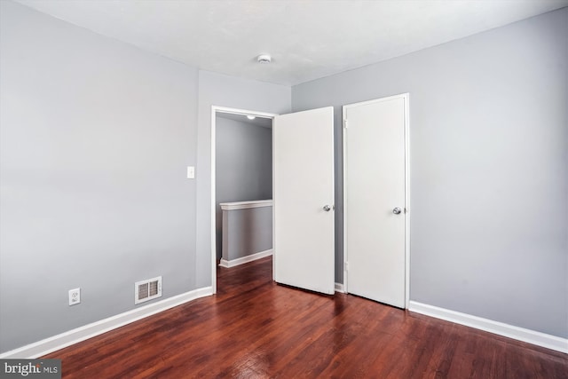 6023 20th Ave, Hyattsville, MD 20782 - unfurnished bedroom with baseboards and wood finished floors