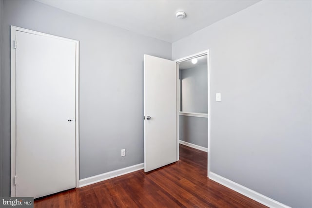 6023 20th Ave, Hyattsville, MD 20782 - unfurnished bedroom with wood finished floors and baseboards