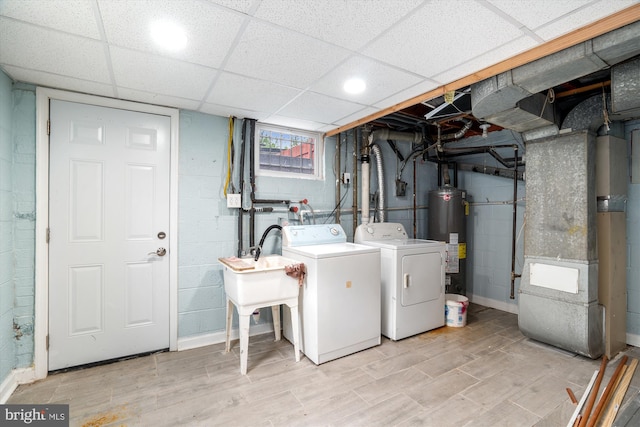 6023 20th Ave, Hyattsville, MD 20782 - laundry area with water heater, independent washer and dryer, light wood finished floors, and heating unit