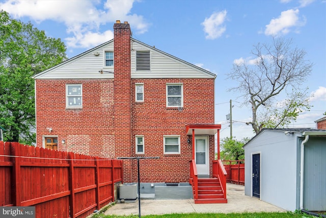 6023 20th Ave, Hyattsville, MD 20782 - back of property with a fenced backyard, entry steps, cooling unit, and brick siding