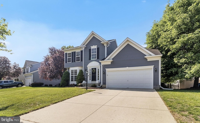 view of front facade with an attached garage, a front yard, and driveway