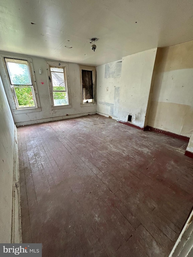 unfurnished living room featuring hardwood / wood-style flooring