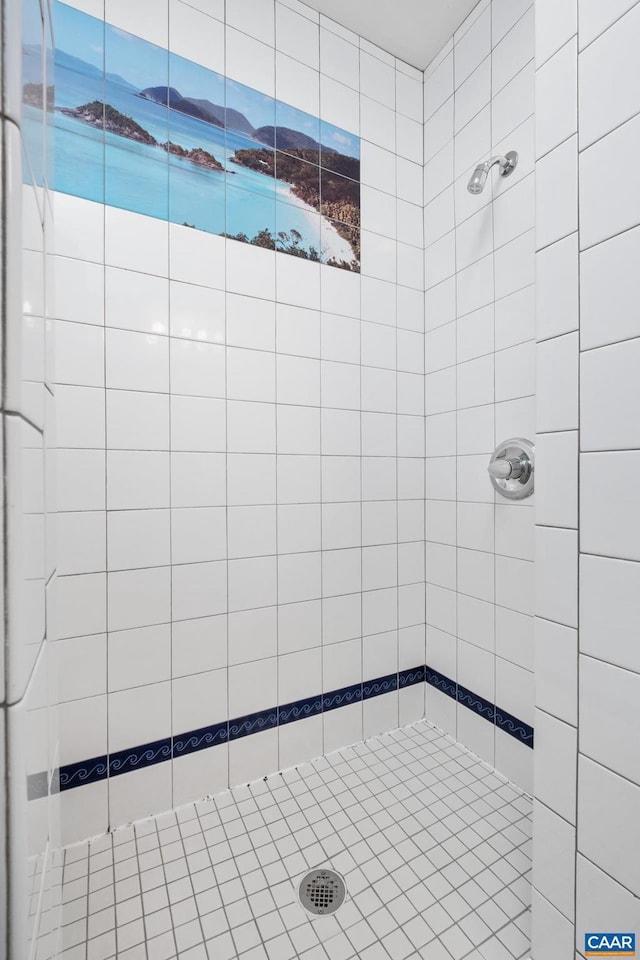 bathroom with tiled shower