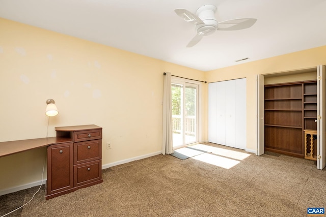 unfurnished bedroom featuring a ceiling fan, visible vents, baseboards, access to outside, and carpet