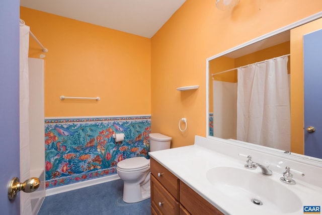 bathroom with toilet, wallpapered walls, and vanity