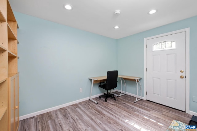 office area with recessed lighting, baseboards, and light wood-style flooring