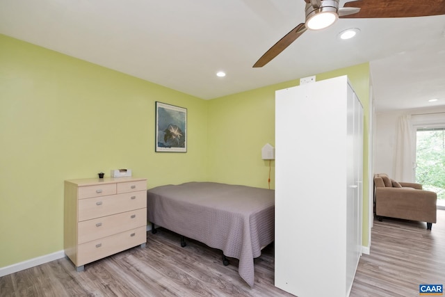 bedroom featuring recessed lighting, light wood-style flooring, and baseboards
