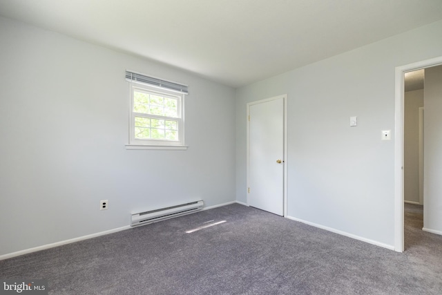 carpeted spare room with baseboards and baseboard heating