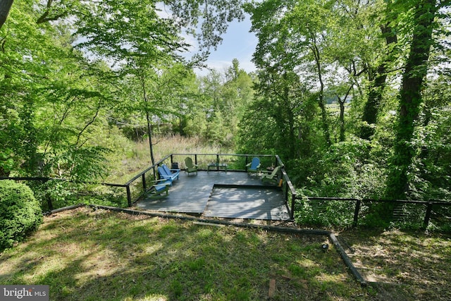 view of yard with a wooden deck