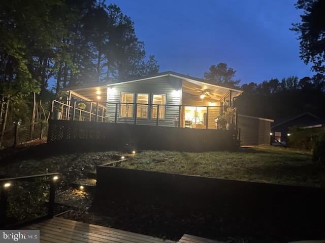 view of back of house at twilight