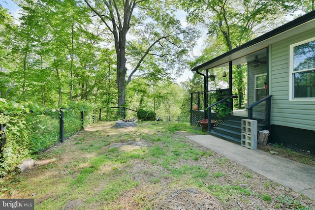 view of yard featuring ceiling fan