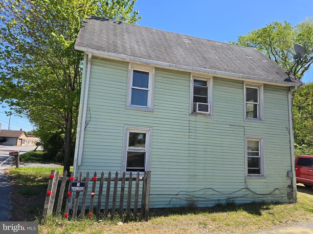 32939 Old Ocean City Rd, Parsonsburg, MD 21849 - view of home's exterior with fence and a shingled roof