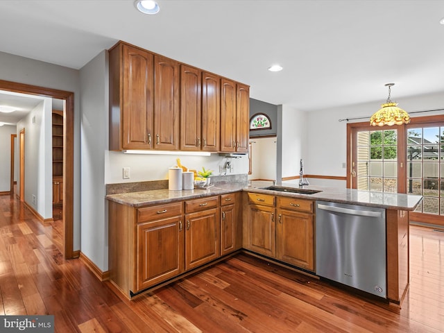 12553 Fawn Dr, Laurel, DE 19956 - kitchen with stainless steel dishwasher, a sink, brown cabinets, dark wood-type flooring, and recessed lighting