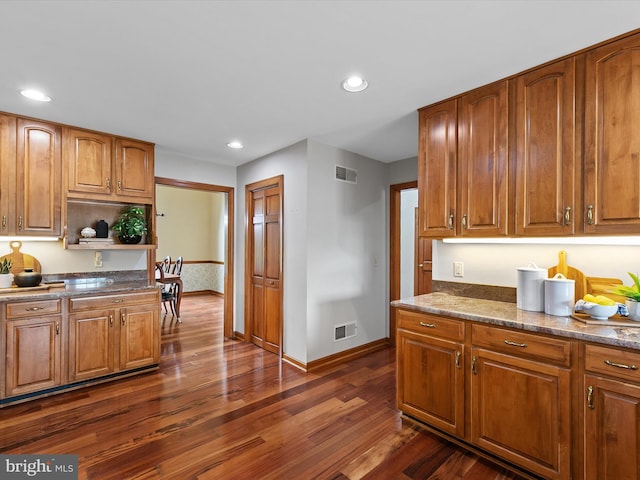 12553 Fawn Dr, Laurel, DE 19956 - kitchen featuring dark wood finished floors, baseboards, recessed lighting, and brown cabinetry