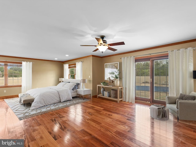 12553 Fawn Dr, Laurel, DE 19956 - bedroom with access to exterior, multiple windows, crown molding, wood finished floors, and baseboards
