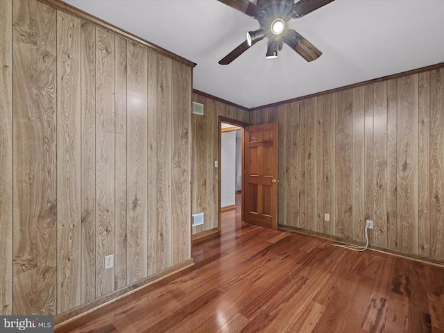 12553 Fawn Dr, Laurel, DE 19956 - spare room with a ceiling fan, wood finished floors, wooden walls, and baseboards