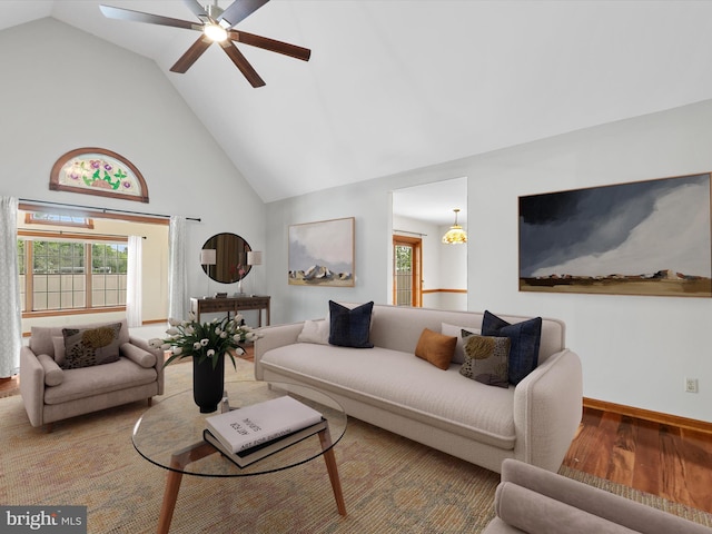 12553 Fawn Dr, Laurel, DE 19956 - living room with high vaulted ceiling, wood finished floors, a ceiling fan, healthy amount of natural light, and baseboards