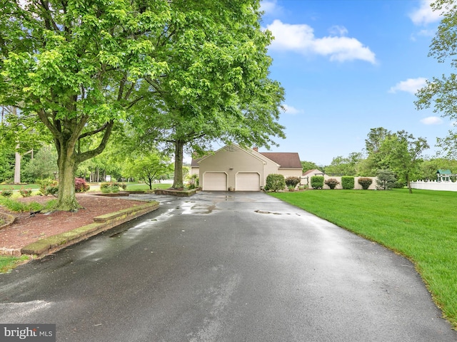 12553 Fawn Dr, Laurel, DE 19956 - view of front of property with asphalt driveway, a front lawn, and an attached garage