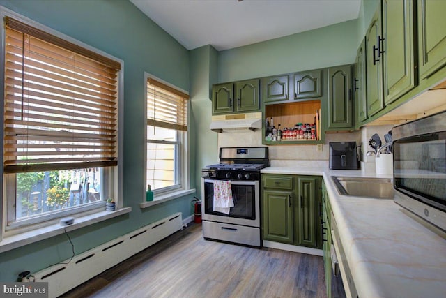 4324 Cresson St, Philadelphia, PA 19127 - kitchen featuring green cabinetry, appliances with stainless steel finishes, baseboard heating, light countertops, and under cabinet range hood