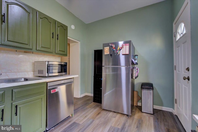 4324 Cresson St, Philadelphia, PA 19127 - kitchen featuring light wood-style floors, light countertops, green cabinetry, and stainless steel appliances