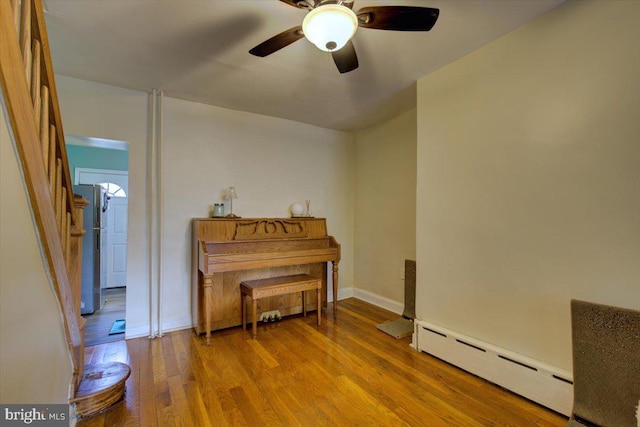 4324 Cresson St, Philadelphia, PA 19127 - living area with baseboards, ceiling fan, a baseboard heating unit, and wood finished floors