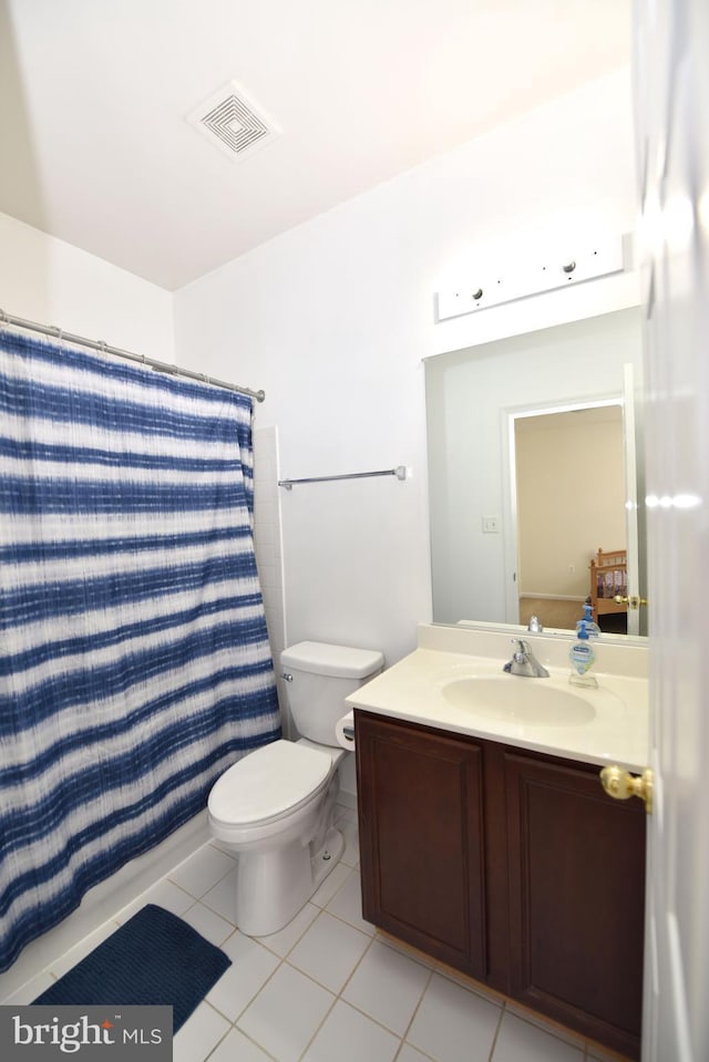 bathroom with tile patterned flooring, vanity, toilet, a shower with shower curtain, and visible vents