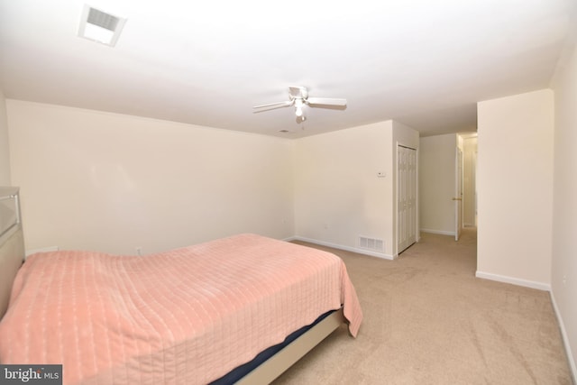 bedroom featuring visible vents, a ceiling fan, baseboards, and light carpet