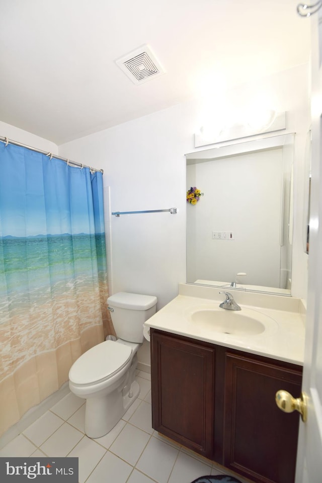bathroom with visible vents, vanity, toilet, a shower with shower curtain, and tile patterned floors