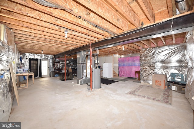 basement featuring heating unit and water heater