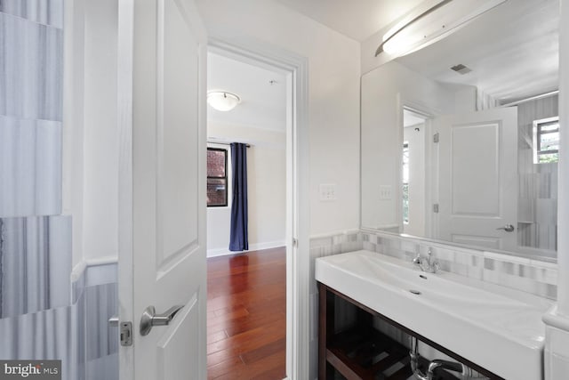 bathroom featuring vanity, wood finished floors, and visible vents