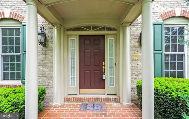 entrance to property with brick siding