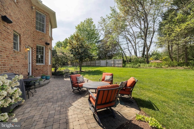 view of patio / terrace featuring fence