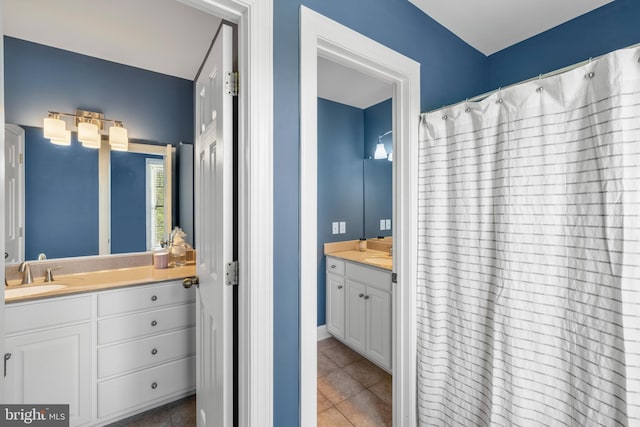bathroom with vanity and tile patterned flooring