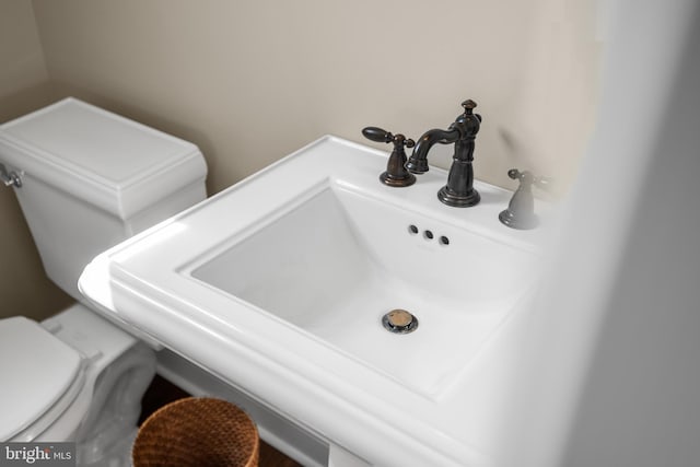 interior details with a sink and toilet
