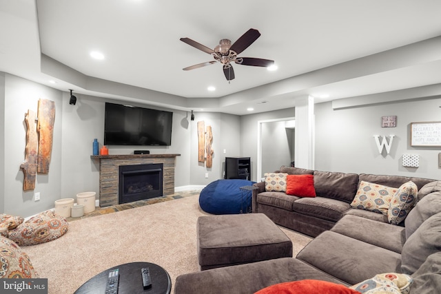 carpeted living area featuring ceiling fan, a fireplace, and recessed lighting