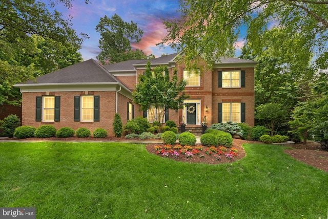 12019 Wandabury Rd, Oakton, VA 22124 - view of front of house featuring brick siding, a lawn, and roof with shingles