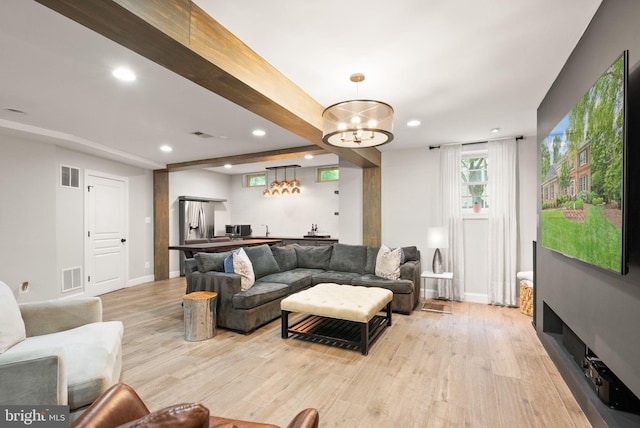 12019 Wandabury Rd, Oakton, VA 22124 - living area with light wood-type flooring, recessed lighting, wet bar, a chandelier, and baseboards