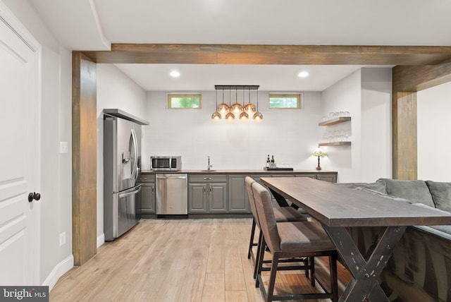 12019 Wandabury Rd, Oakton, VA 22124 - kitchen featuring stainless steel appliances, gray cabinetry, a sink, light wood-style floors, and recessed lighting