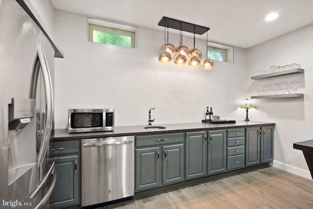 12019 Wandabury Rd, Oakton, VA 22124 - kitchen with stainless steel appliances, a sink, light wood finished floors, healthy amount of natural light, and recessed lighting