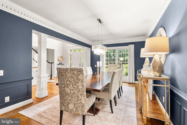 12019 Wandabury Rd, Oakton, VA 22124 - dining room featuring wood finished floors, stairs, crown molding, and ornate columns