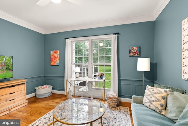 12019 Wandabury Rd, Oakton, VA 22124 - living area with wood finished floors, ornamental molding, a decorative wall, ceiling fan, and a wainscoted wall