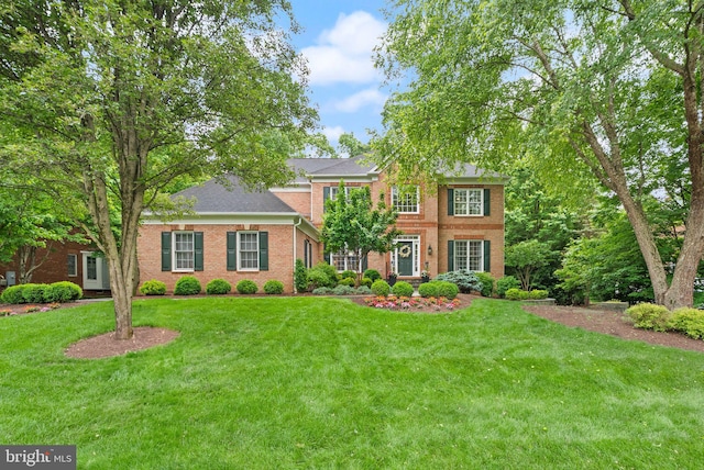12019 Wandabury Rd, Oakton, VA 22124 - view of front of property featuring a front yard, brick siding, and a shingled roof